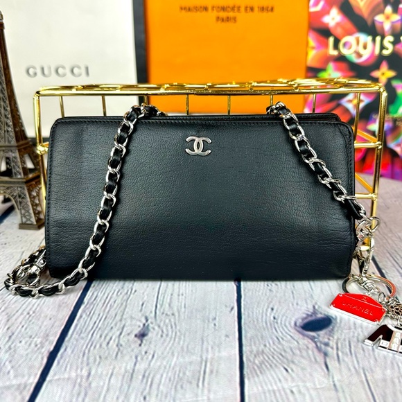 CHANEL Handbags - CHANEL black leather wallet crossbody bag with chain and charm